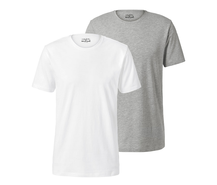 Dvě trička s kulatým výstřihem, bílé a šedé, leží vedle sebe.
