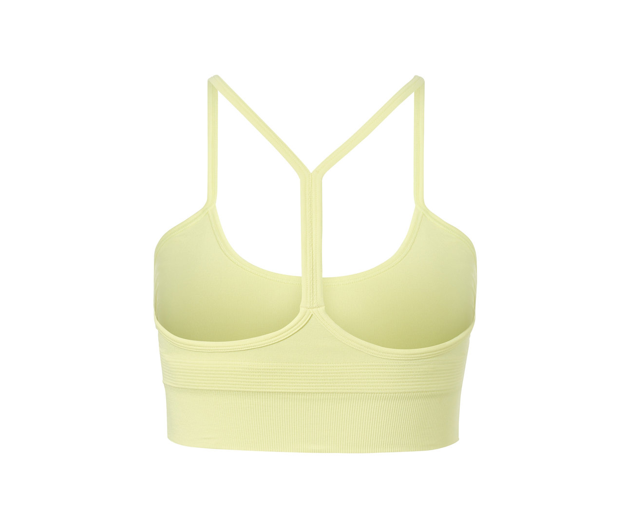 Detail žluté bezešvé sportovní podprsenky s tenkými ramínky.