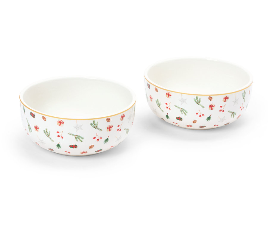 Dvě misky s vánočním motivem stojí na bílém pozadí.