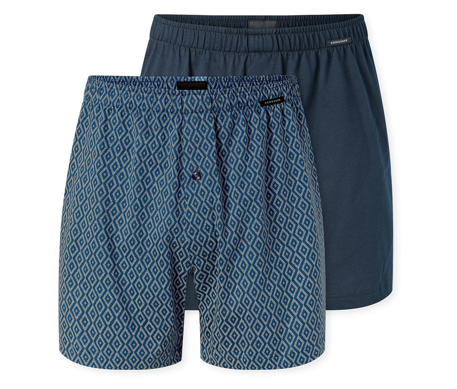 Dvoje žerzejové boxerky SCHIESSER; jedny modré s bílým kosočtvercovým vzorem a knoflíkovým poklopcem, druhé jednobarevné tmavě modré.