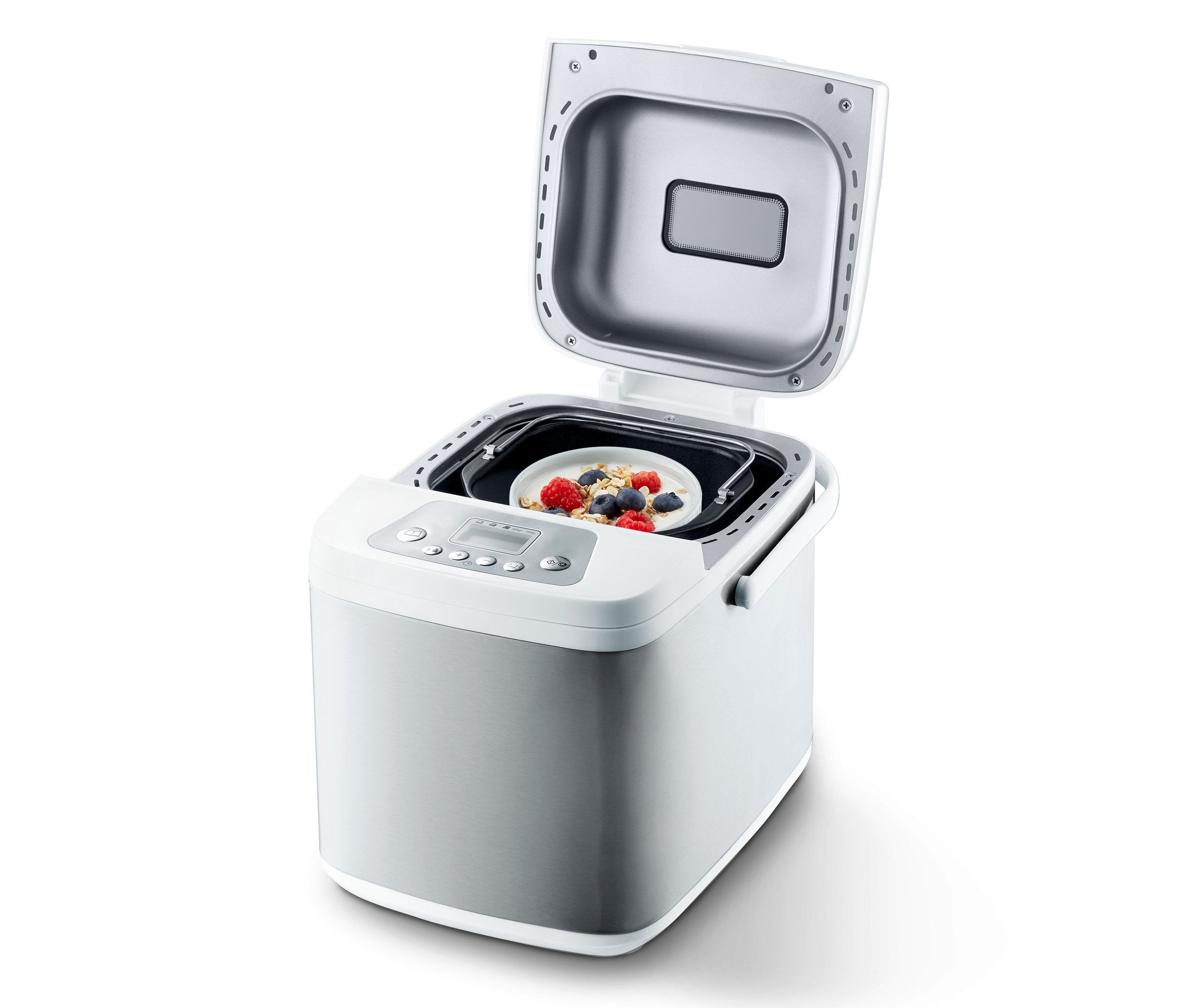 Otevřená domácí pekárna s miskou ovesných vloček a bobulí uvnitř.