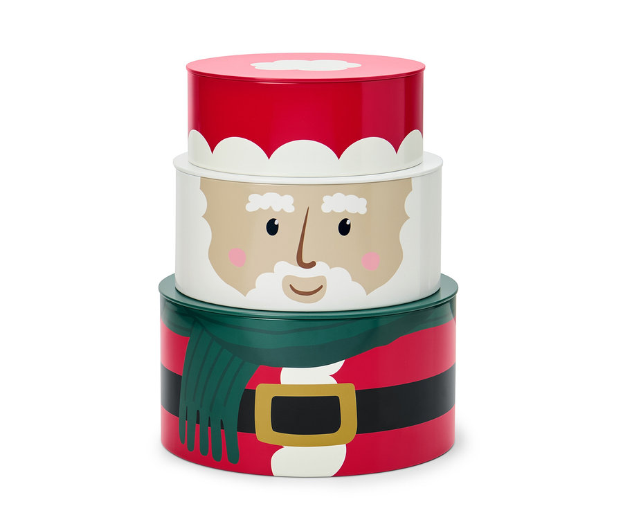Sada tří dóz na cukroví s vánočním motivem, které jsou naskládané na sobě.