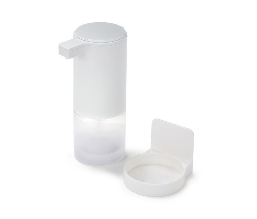 Bílý dávkovač mýdla se senzorem a držákem.