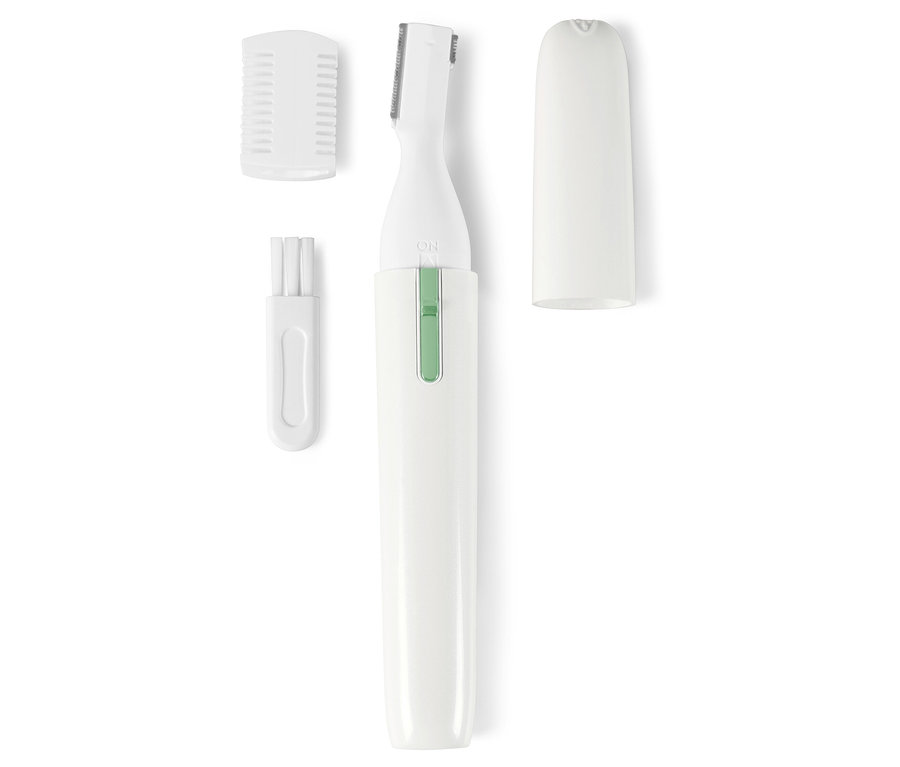 Detail bílého zastřihovače s nástavci a krytem.