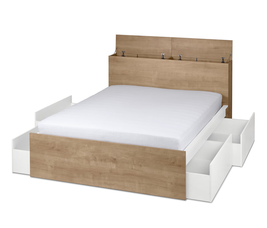 Postel s úložným prostorem s bílými zásuvkami.
