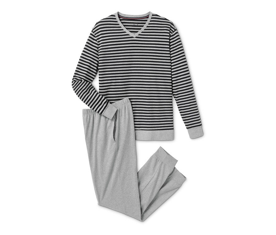 Položené pyžamo s dlouhým rukávem s černými a šedými pruhy a šedé pyžamové kalhoty.