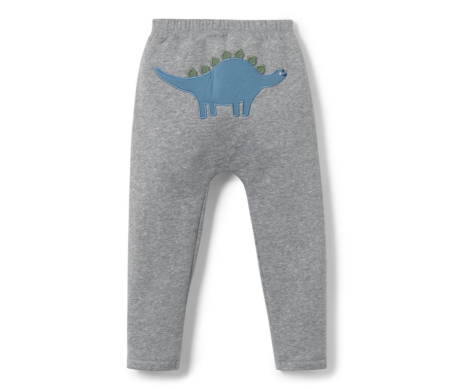 Šedé tepláky pro miminka s aplikací modrého dinosaura.