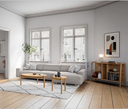 Obývací pokoj s pohovkou, komodou a designovou stolní LED lampou.
