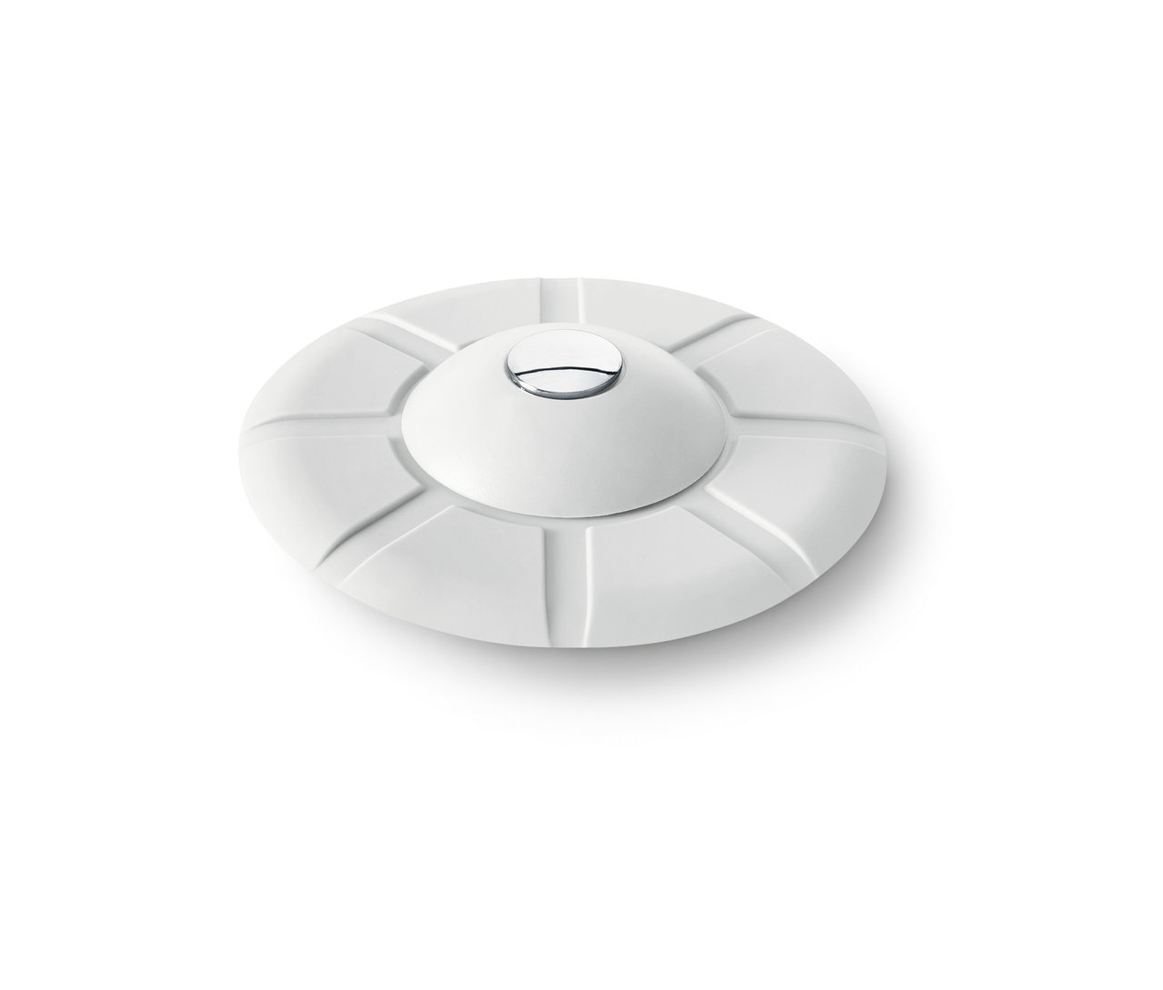 Bílé odtokové sítko a zátka.