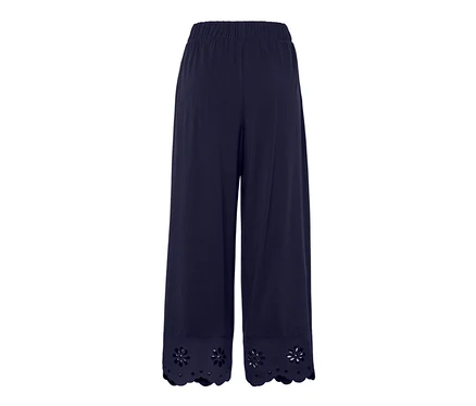 Tmavě modré culottes kalhoty s výšivkou na lemu.