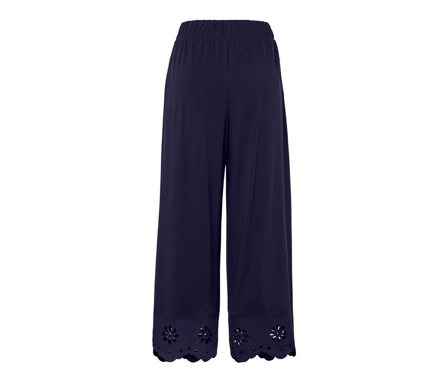 Tmavě modré culottes kalhoty s výšivkou na lemu.