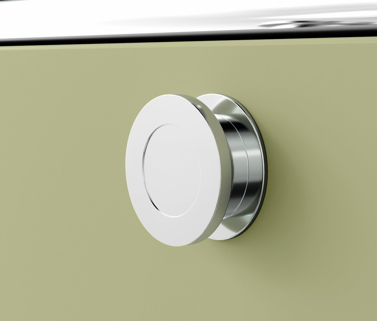 Detail chromové kulaté úchytky na zeleném nábytku.