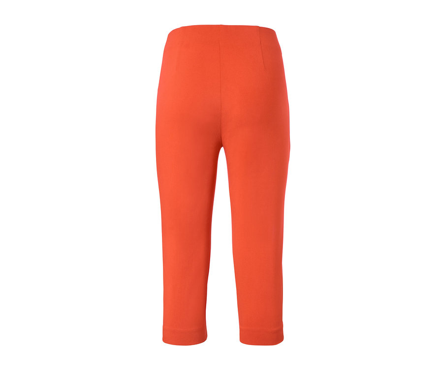 Oranžové 3/4 strečové kalhoty.