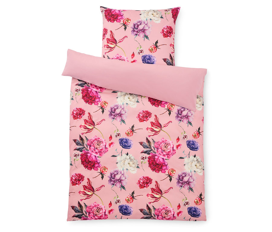Růžová ložní souprava s květinovým vzorem s polštářem a povlakem.