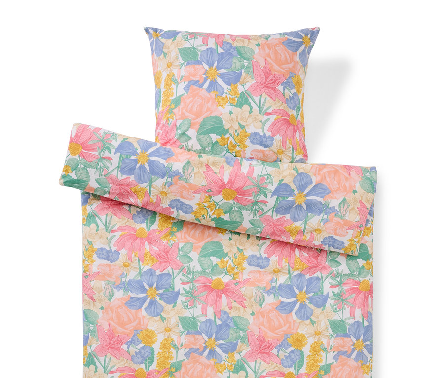 Květinová sada ložního prádla s polštářem a povlakem na přikrývku.