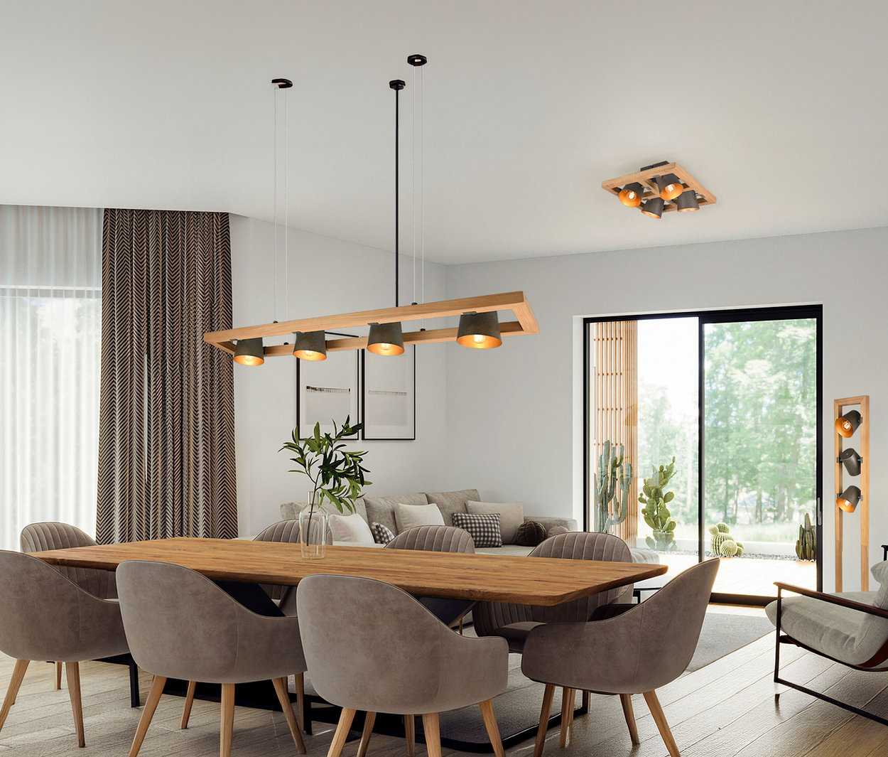 Jídelní stůl se šesti židlemi pod závěsným svítidlem Trio »Bell«, se 4 světly. Na stropě je namontováno další svítidlo Trio.