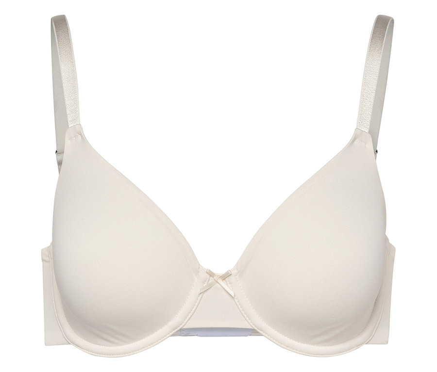 Krémová podprsenka s kosticemi a mašličkou uprostřed.