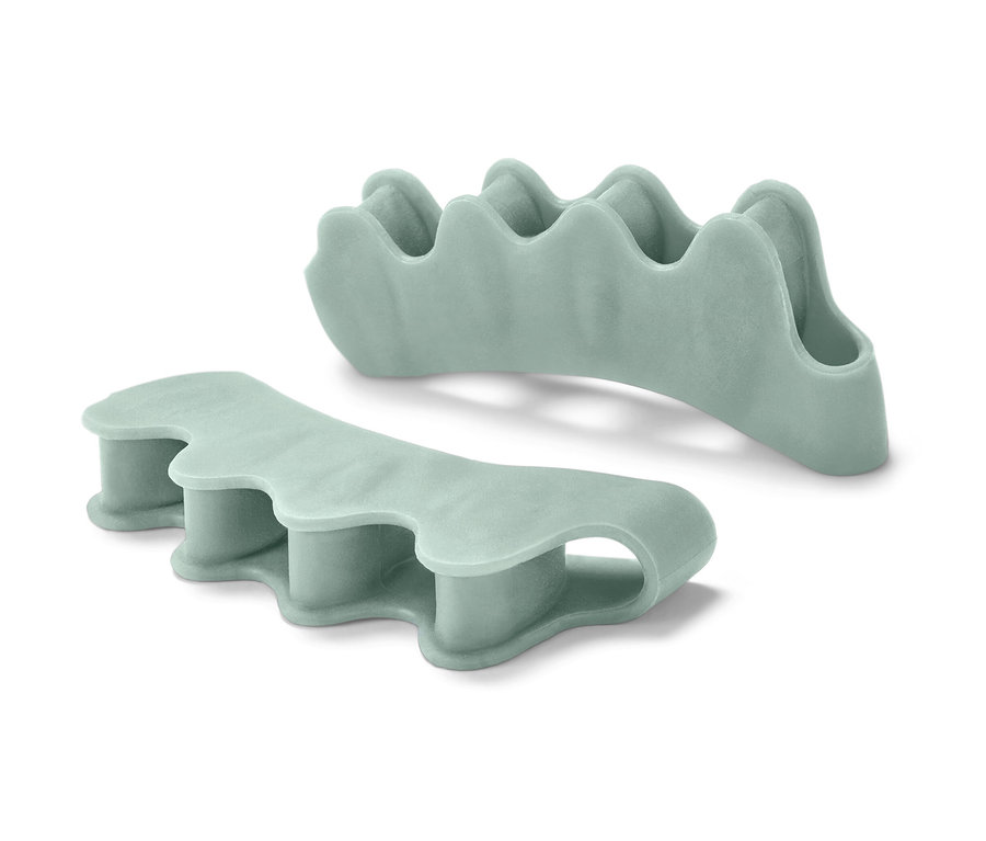 Dva oddělovače prstů na noze světle zelené barvy.