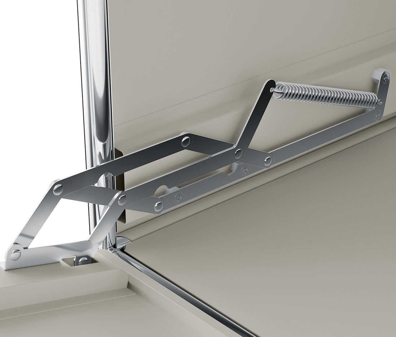 Detail stříbrného mechanismu s pružinou připevněného k béžové skříňce.
