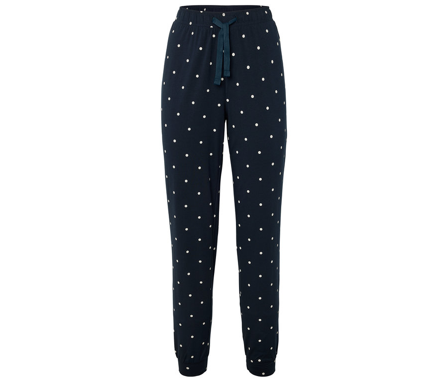 Tmavě modré tepláky s bílými puntíky a stahovací šňůrkou.