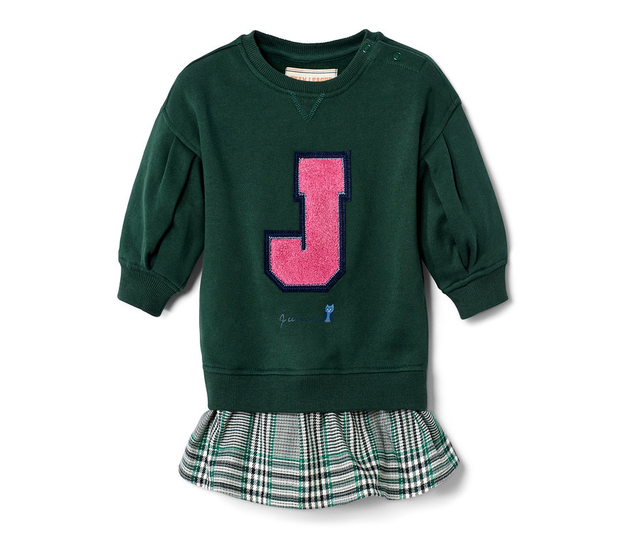 Zelené šaty s kostkovanou sukní a růžovým písmenem J.