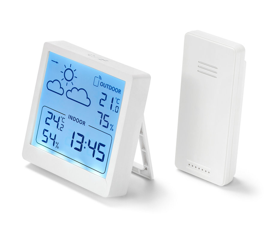 Dve bílé meteostanice ukazují teplotu a vlhkost.