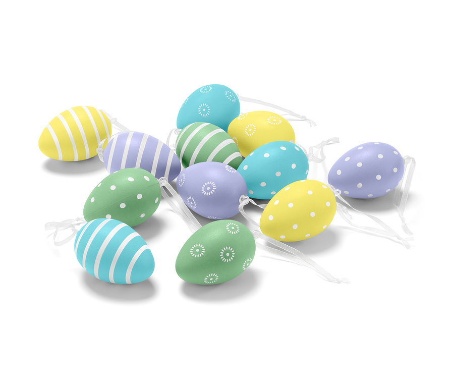 Sada dvanácti velikonočních vajíček s různými vzory a barvami.