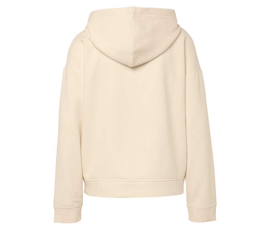 Zadní strana béžové mikiny s kapucí.