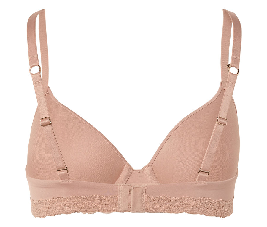 Pohled zezadu na béžovou podprsenku s nastavitelnými ramínky a krajkovým lemem pod prsy.
