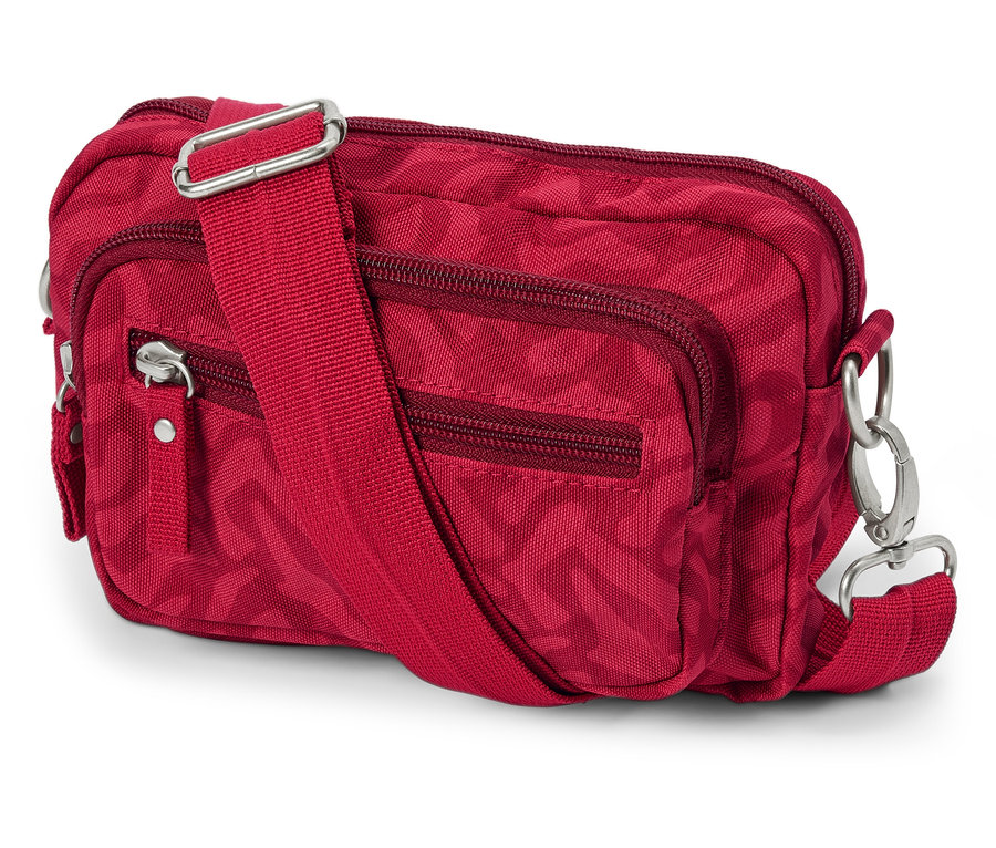 Červená bezpečnostní taštička přes rameno nebo ledvinka se zipy a nastavitelným popruhem leží na bílém pozadí.
