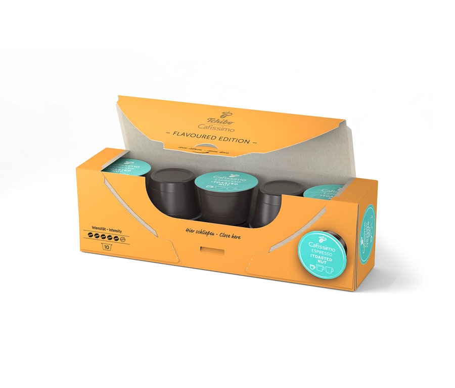 Otevřené oranžové balení Cafissimo Flavoured Espresso Toasted Nut s 10 kapslemi, kapsle jsou uvnitř viditelné.