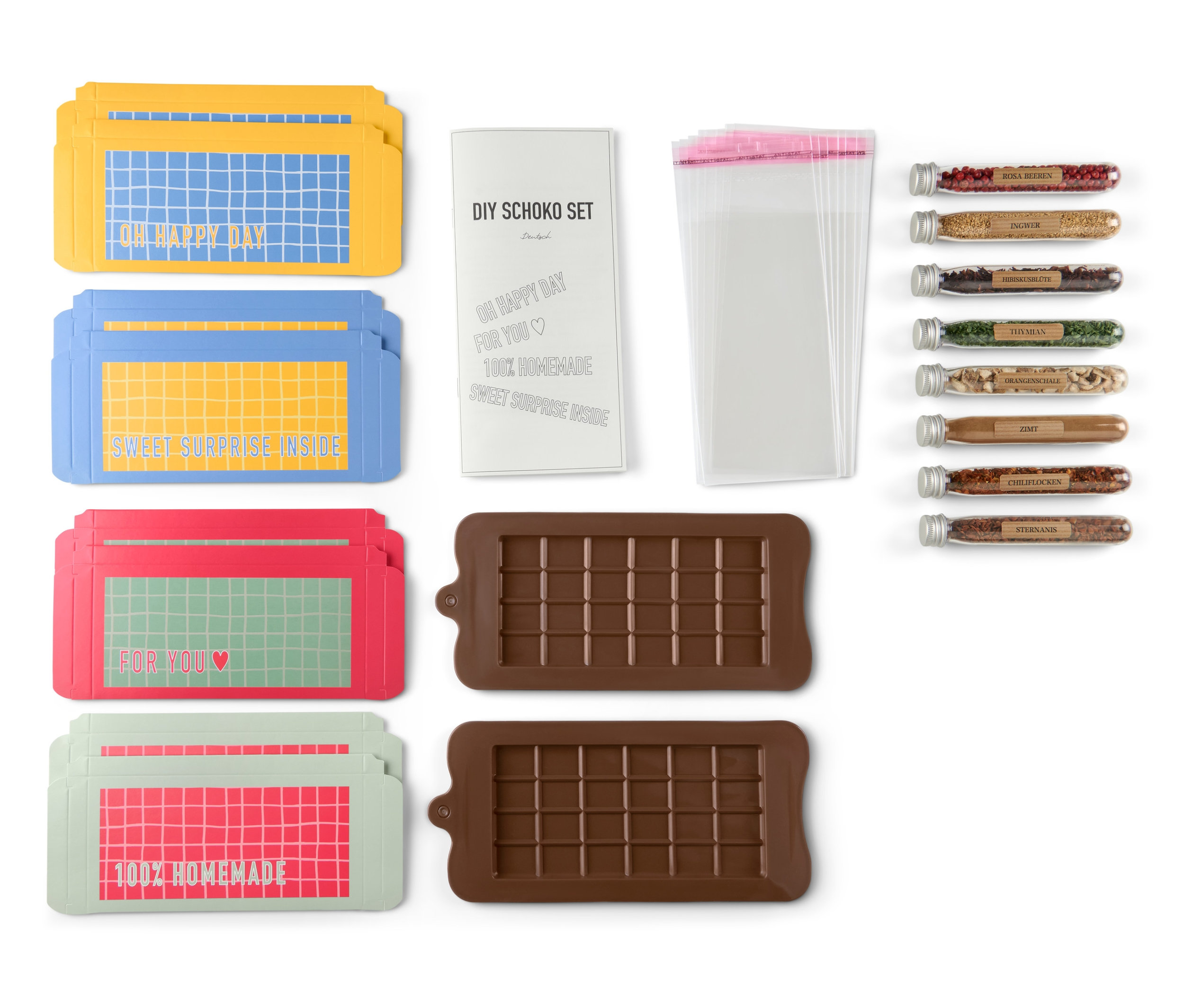Sada na výrobu tabulek čokolády s obaly, sáčky, tubami s kořením a formami.
