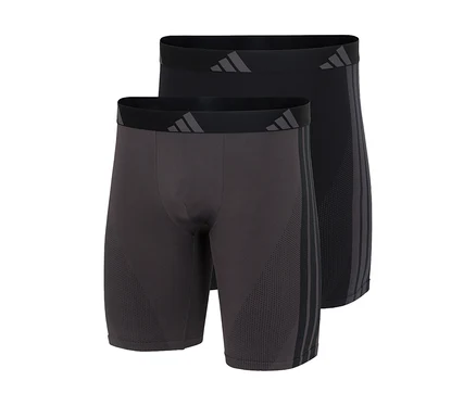 Dvoje boxerky adidas Active Seamless Long v tmavě šedé a černé barvě, s logem adidas na pase a třemi pruhy na boku.