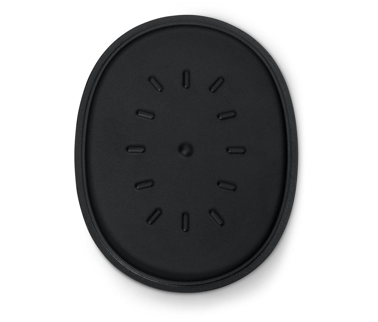 Černá oválná podložka s drážkami.