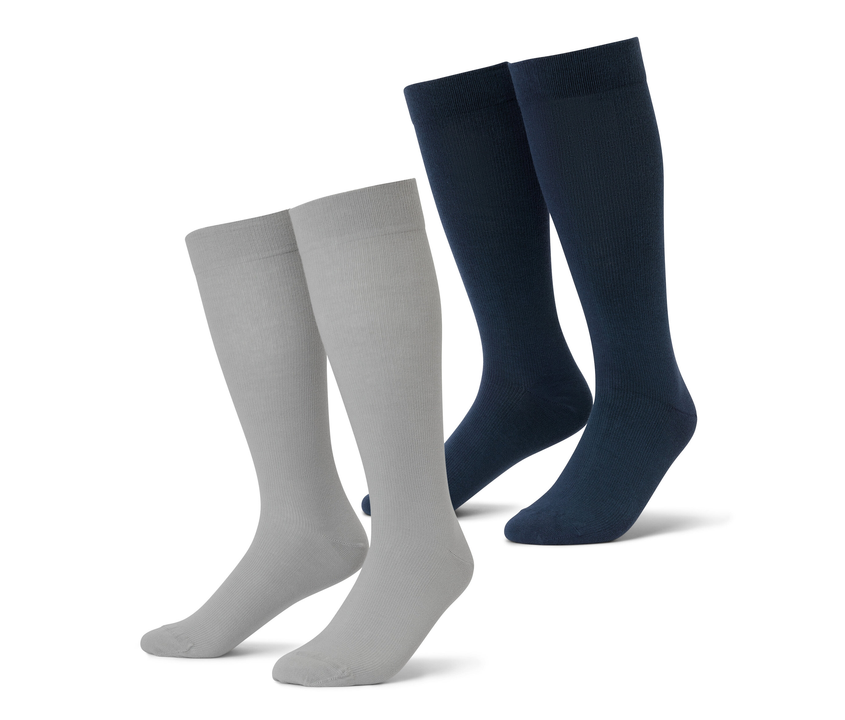 Dva páry cestovních kompresních punčoch v šedé a tmavě modré barvě.