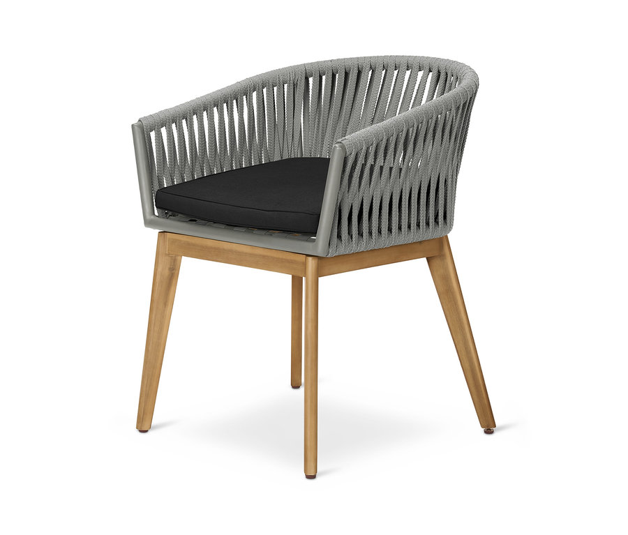Detailní záběr jídelní židle Křeslo s textilním výpletem s šedým textilním výpletem a černým sedákem.