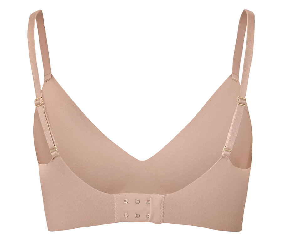 Pohled zezadu na tělovou podprsenku s nastavitelnými ramínky a háčkovým zapínáním.