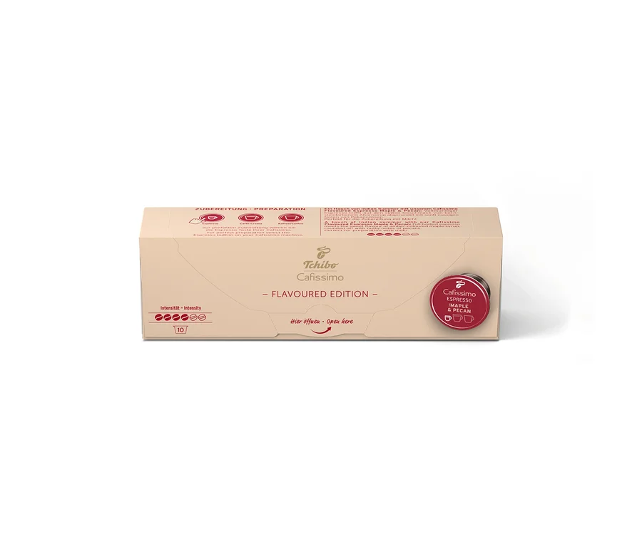 Světle hnědá kartonová krabička Cafissimo Flavoured Espresso Maple & Pecan s 10 kapslemi, indikátorem intenzity a červeným štítkem.