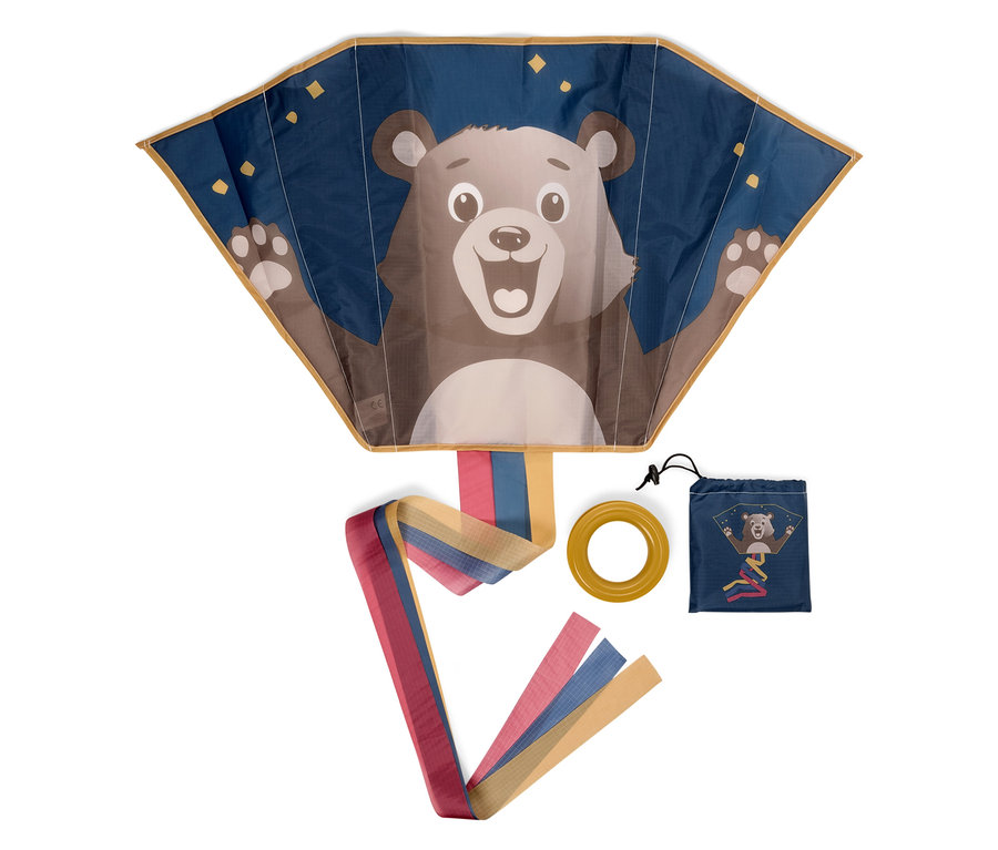 Modrý drak s medvědem, žlutý kruh a modrý obal se stejným potiskem na bílém pozadí.