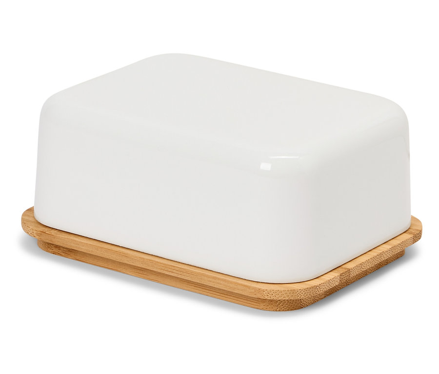 Bílá máslenka s bambusovým víkem na bílém povrchu.