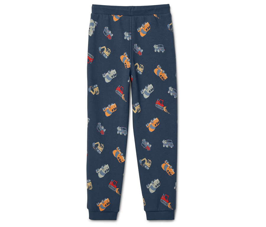 Modré tepláky s motivem bagru.