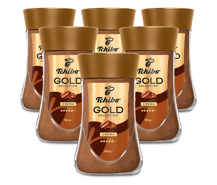 Šest sklenic instantní kávy Tchibo Gold Selection Crema uspořádaných do dvou řad.