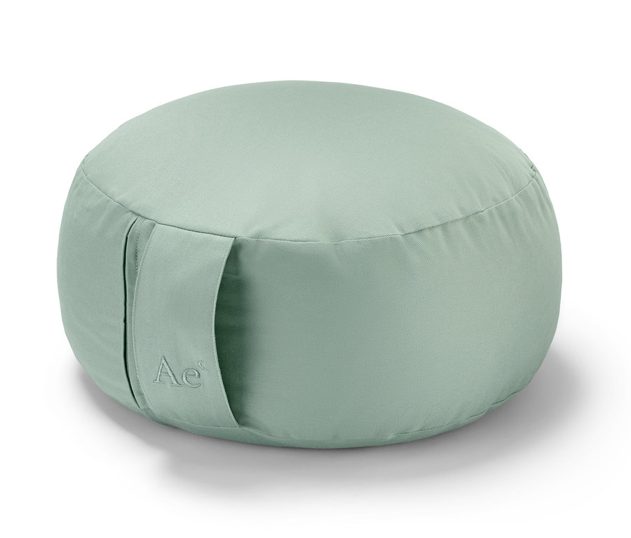 Zelený meditační polštářek.