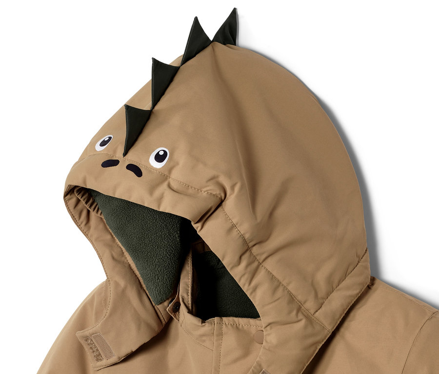 Detail dětské zimní kombinézy s kapucí s motivem dinosaura.