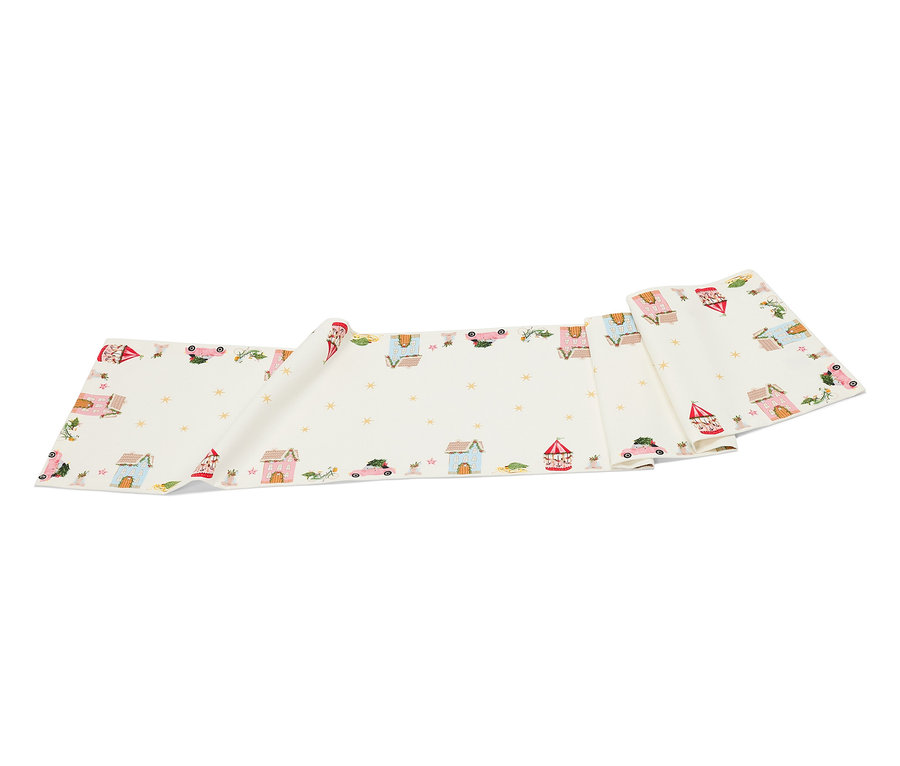 Bílý látkový pás s kreslenými domy, auty a hvězdami.