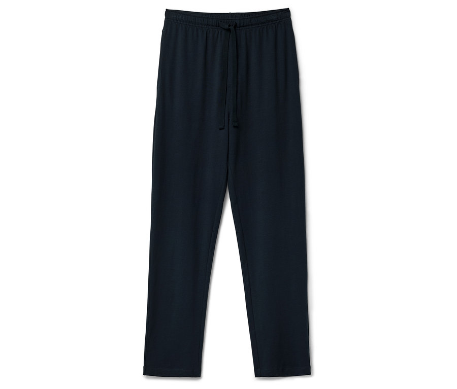 Tmavě modré tepláky se stahovací šňůrkou v pase leží na bílém pozadí.