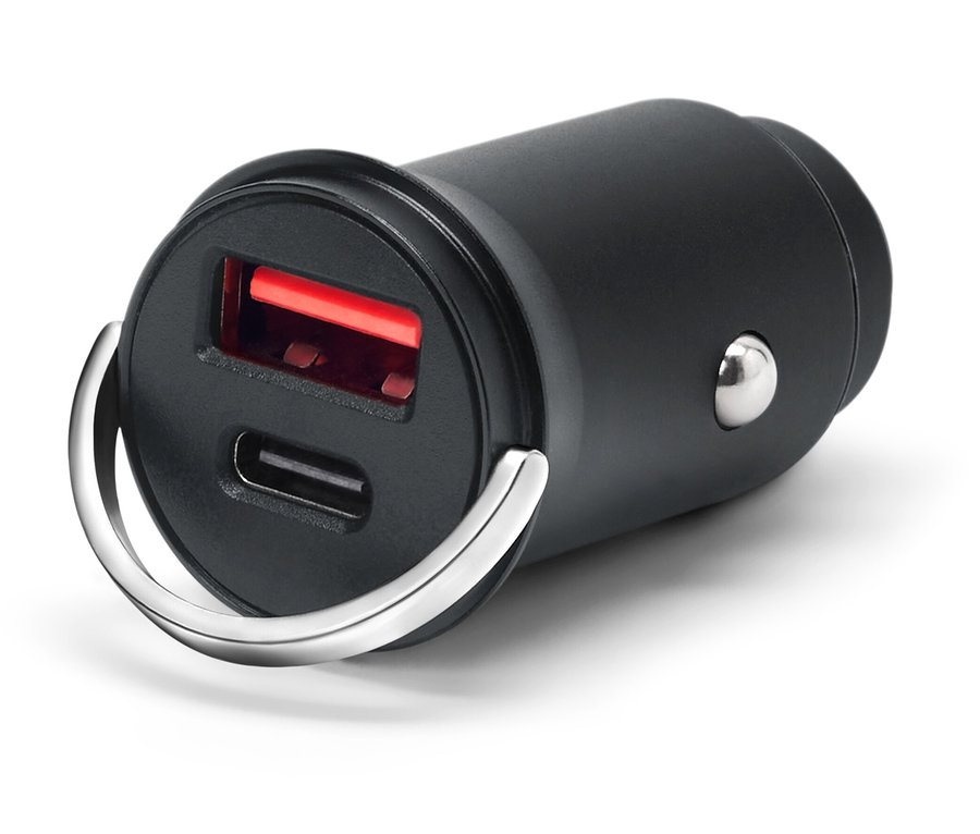 Černá USB nabíječka se dvěma porty a stříbrným kroužkem na bílém pozadí.