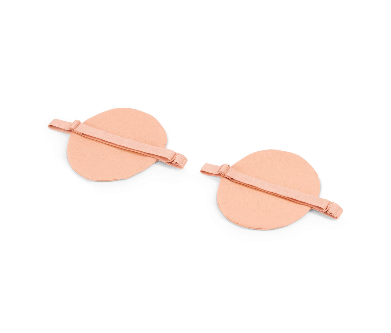 Dva páry béžových podpažních vložek.