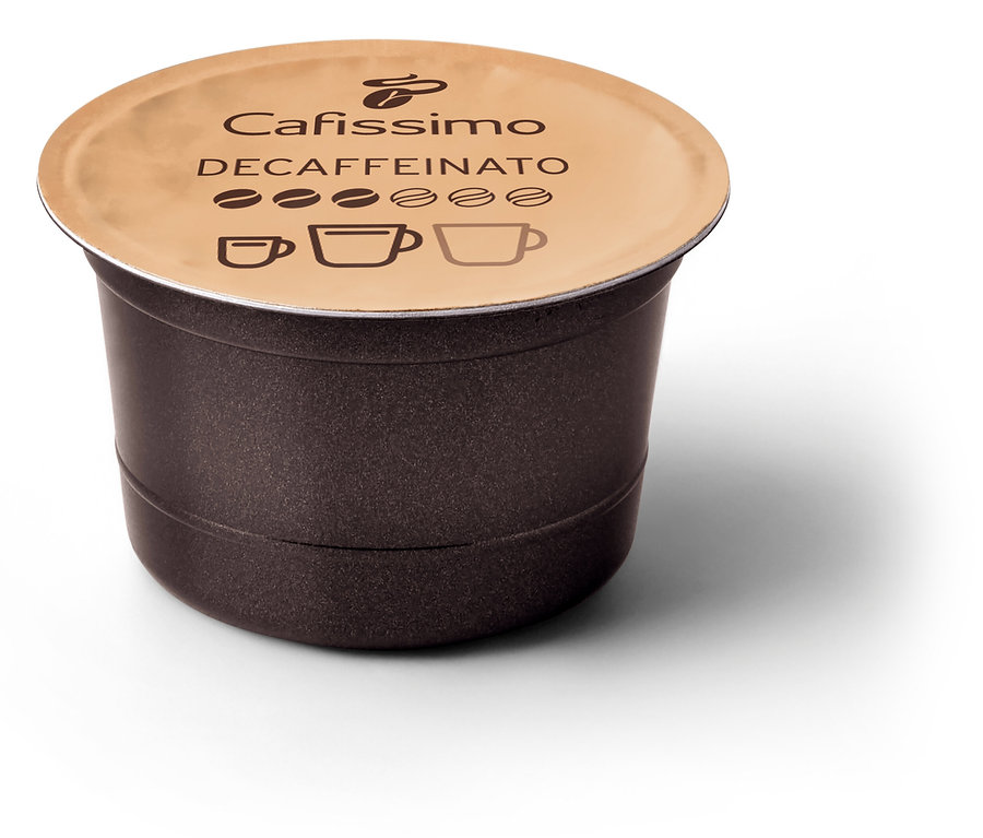Detailní záběr hnědé kapsle Cafissimo bez kofeinu s béžovým víčkem na bílém pozadí.