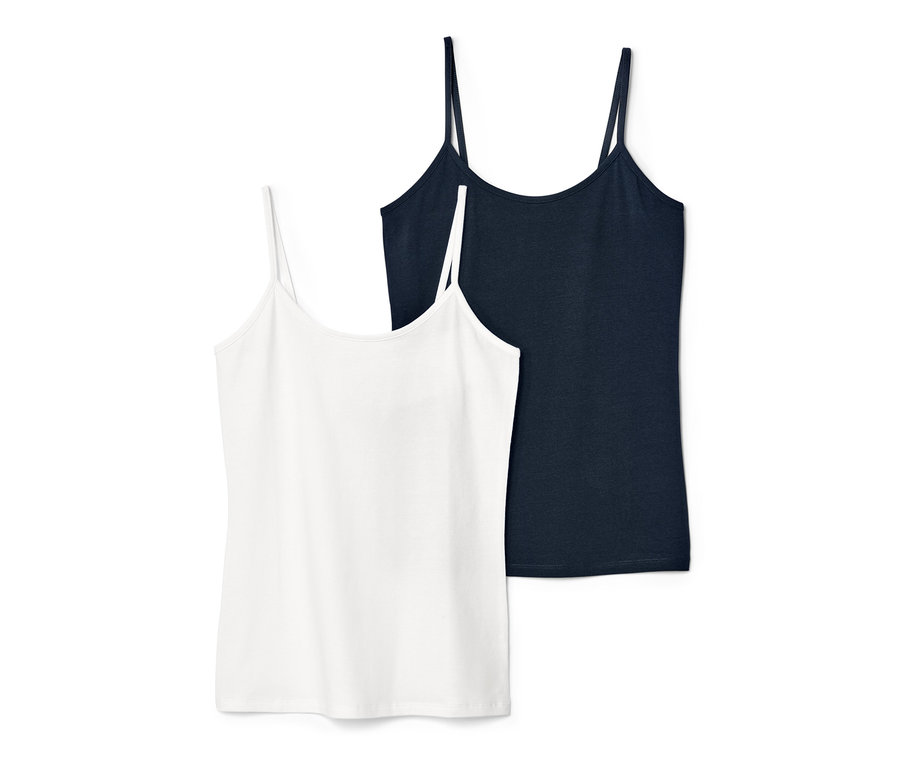 Dvě tílka: modré a bílé.